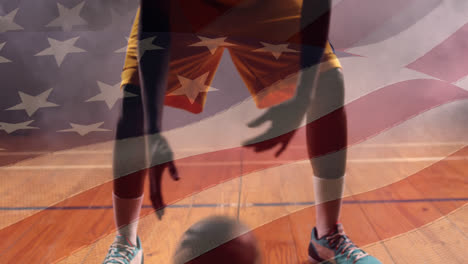 animación de la bandera de los estados unidos de américa sobre un jugador de baloncesto afroamericano
