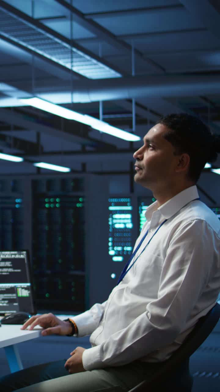 IT Professional Gesturing at Virtual Screen in Data Center
