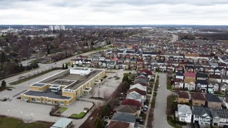 Drone-flying-over-Ajax-neighborhood-in-overcast-weather-in-spring