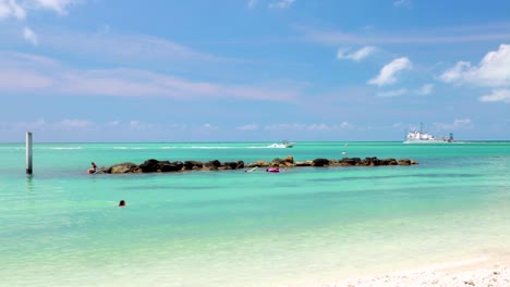 A-beach-in-Key-West,-Florida-with-ships-sailing-in-the-Gulf-of-Mexico