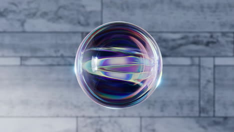 iridescent sphere floating against concrete background