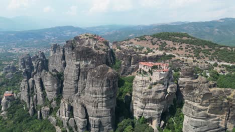 meteora monasteries and rock formations in thessaly, greece mainland - aerial 4k