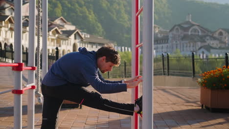 Young Man Stretching Outdoors