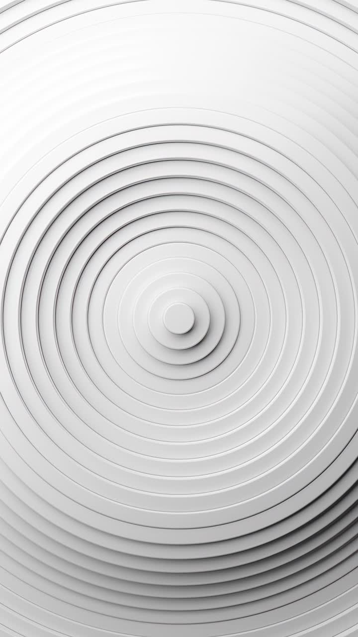 White circular object with white center and black center. Vertical looped animation