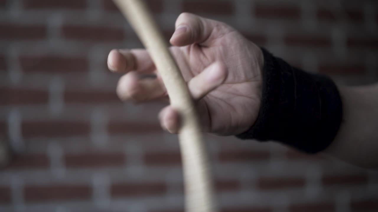 Person practicing with a stick