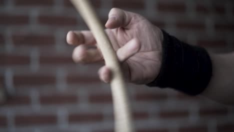 person practicing with a wooden stick