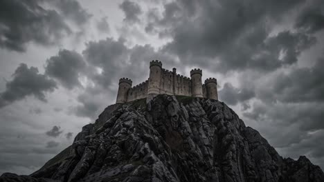 dramatic video concept of a medieval castle shrouded in mist atop rocky cliffs