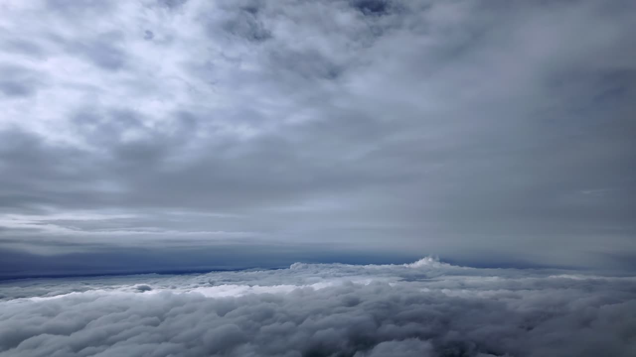 An immersive cockpit view from a jet clmbing through layers of ethereal clouds at supersonic speed in a multilayered sky