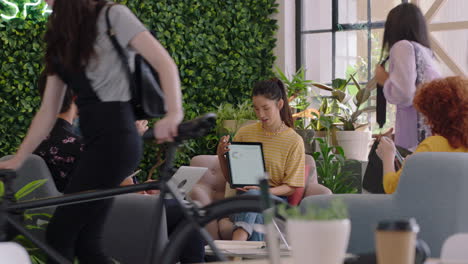 young-group-of-students-meeting-asian-team-leader-woman-using-digital-tablet-computer-presenting-creative-ideas-friends-discussing-business-project-collaborating-in-presentation