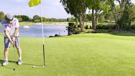 golfer putting on a scenic gold coast course