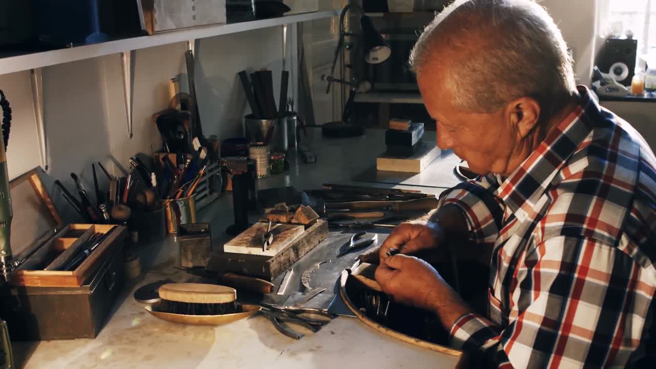 Goldsmith working in workshop