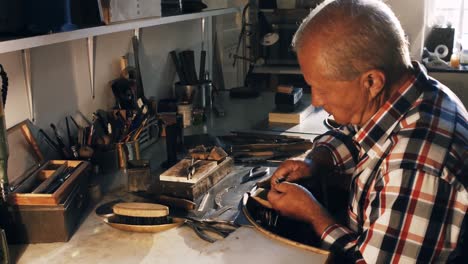 goldsmith working in workshop