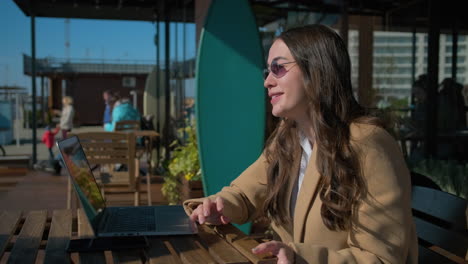 businesswoman working outdoors at a cafe