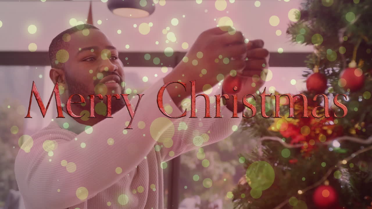 Decorating Christmas tree, man with Merry Christmas text over festive lights