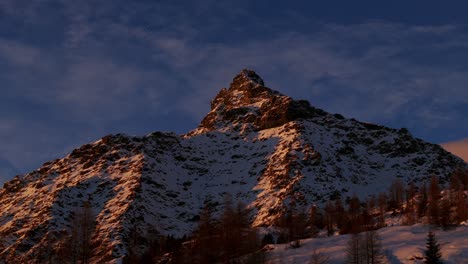 low angle of snow covered mountain peak in winter season, valmalenco in italy