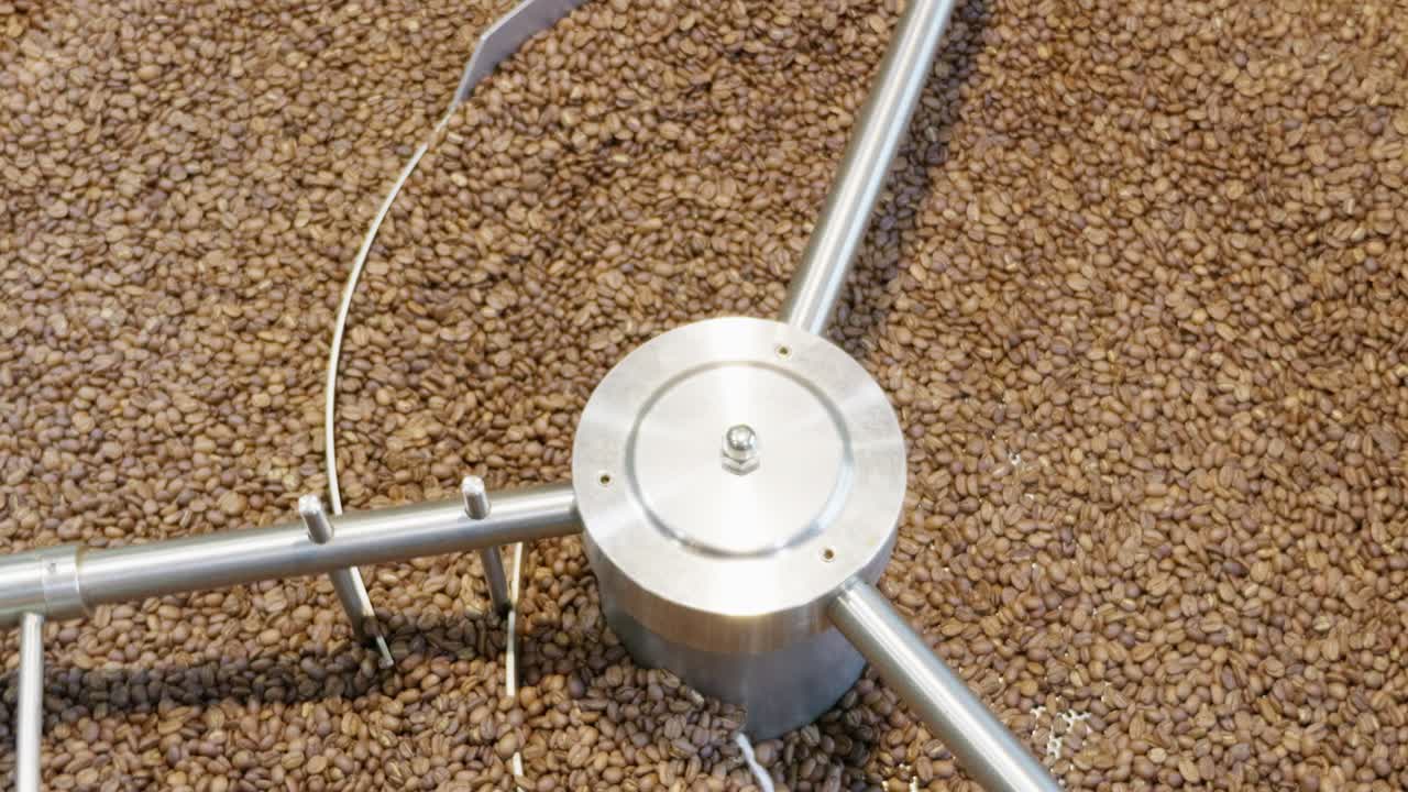 Explore the intricate coffee processing technique in action at a coffee farm showcasing the machinery in detail.