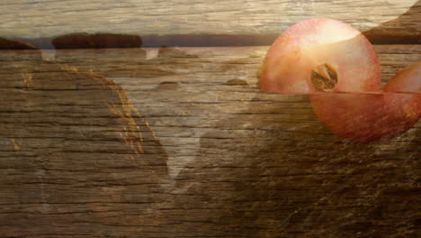 world map overlay on wooden texture with pomegranate showcasing animation elements