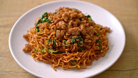 stir-fried instant noodles with thai basil and minced pork - asian food style