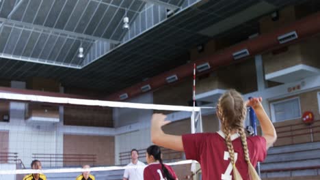 female players playing volleyball in the court 4k