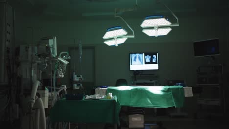 general view of empty operating room with bed and xrays in slow motion