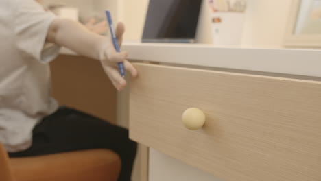 open drawer on a white desk