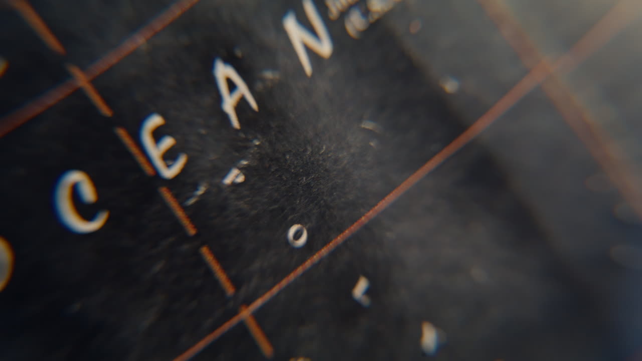 Macro geographical elements globe. Pacific ocean marked on old vintage world map