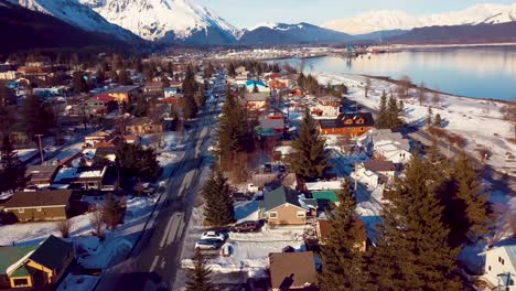 4k drone video of homes in seward, alaska on a snowy winter day