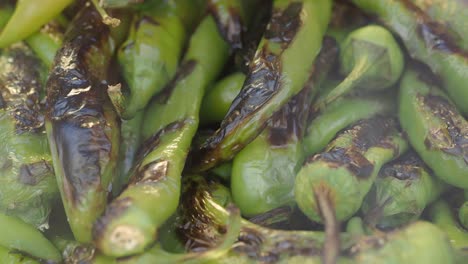 close-up of grilled shishito peppers