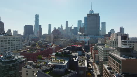 Forwards-fly-above-block-of-buildings-in-city.-Skyline-with-modern-office-buildings.-Manhattan,-New-York-City,-USA