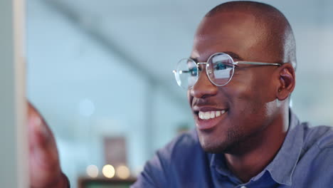 Happy-black-man-on-computer-for-digital