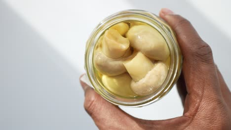 canned mushrooms in a glass jar