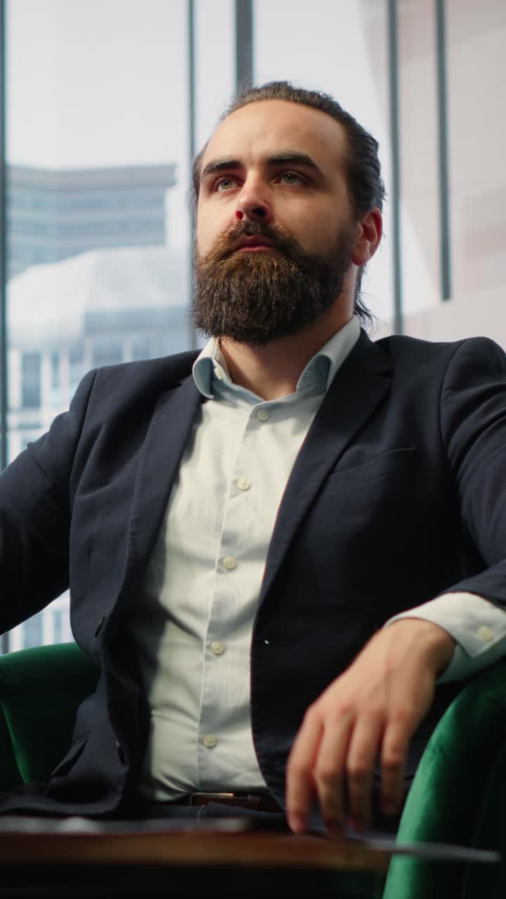 Vertical Video Businessman takes a break from tasks using meditation app for stress relief