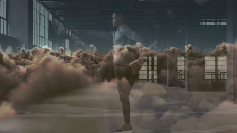 animación de nubes sobre un deportista afroamericano haciendo ejercicio