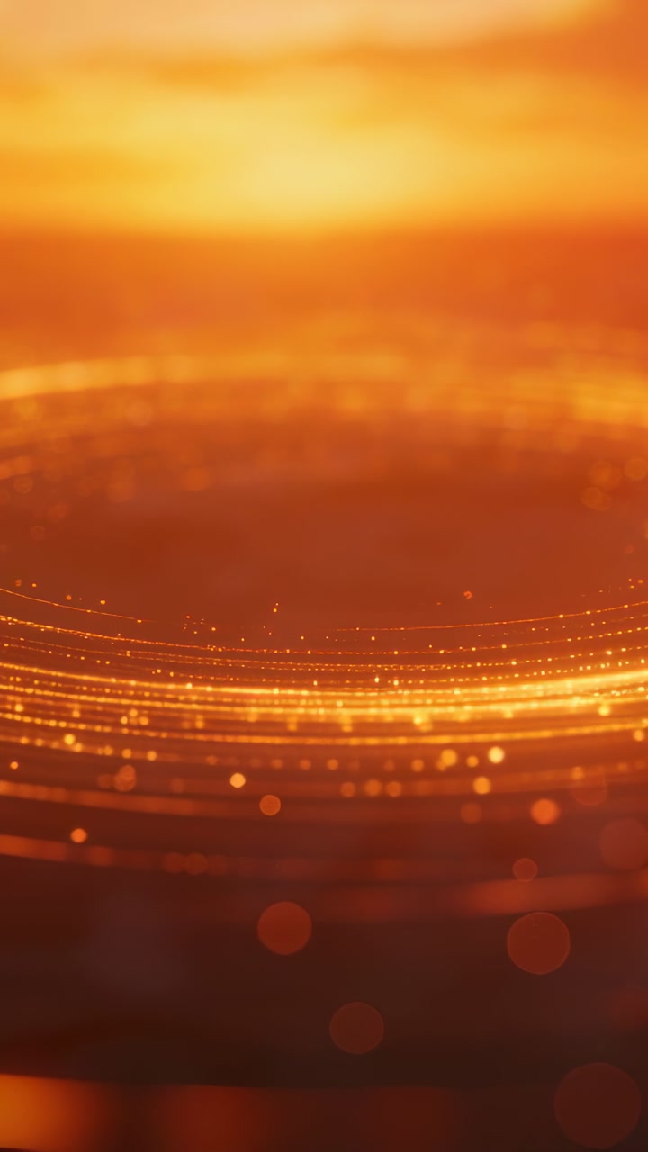 Vertical video: Pulsing glow sparking rings, particles aligning with bokeh, stabilizing in studio