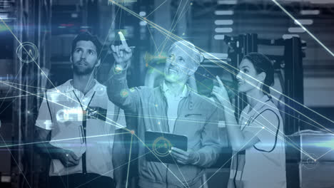 animation of network of connections over caucasian male and female warehouse workers