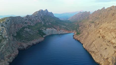 Secluded bay embraced by dramatic limestone cliffs, coastline, aerial