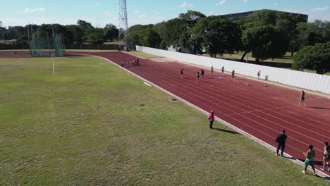 aerial rotates over women's long jump track and field competition