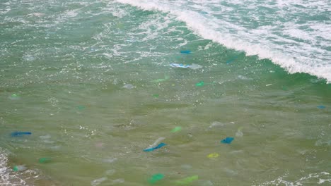 climate change crisis sea polluted by disposable plastic bags and bottles