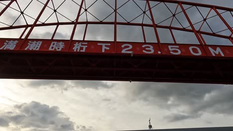 view from a ferry passing under the famous ondo bridge in kure, japan