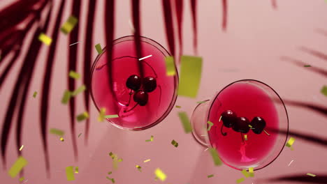 Animation-of-confetti-falling-and-cocktails-on-pink-background