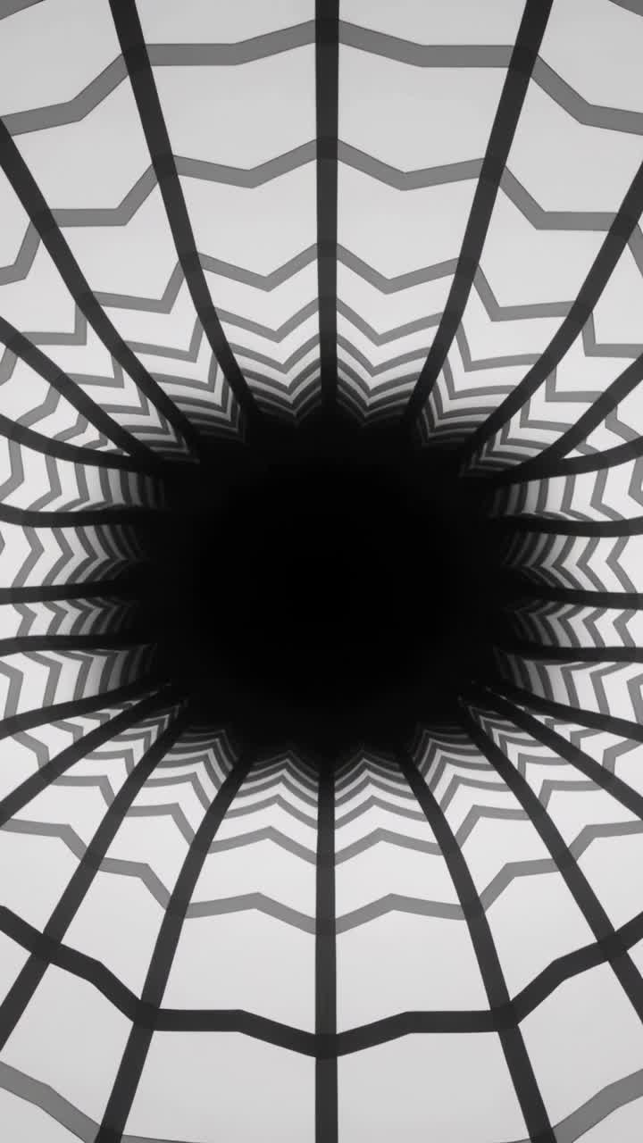 Video verticale: Griglia radiale che si trasforma con un anello a zigzag che si restringe verso l'interno su sfondo grigio mentre il centro riempie il vuoto.