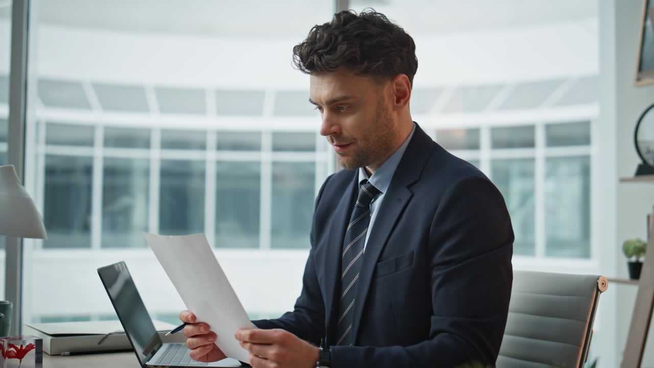Elegant ceo reading agreement at corporate office closeup. Executive making deal