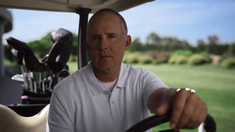 confident golf professional look camera in clubs bag cart outside. sport concept