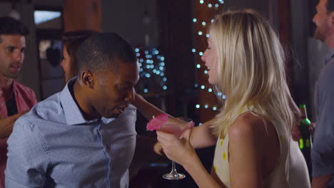 black man and blonde woman dancing at a party, shot on r3d