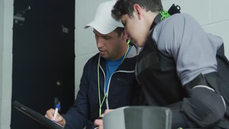 hockey player discussing with his coach