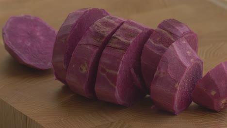 removing the sweet pottoe or camote from the cutting board