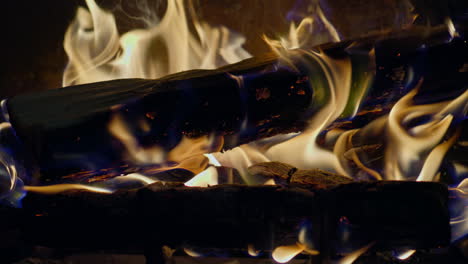 slow motion shot of flames and embers in a fireplace