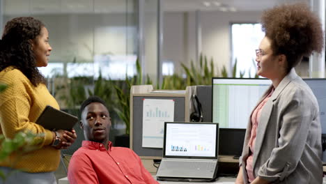 casual diverse businesspeople talking in office, slow motion with copy space