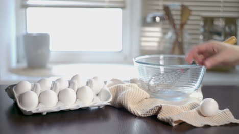 chicken eggs on kitchen table. cook preparing ingredients for food cooking