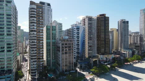 Aerial-view-of-the-beach-and-coming-closer-to-tall-buildings-in-Balneario-Camboriu-Brazil